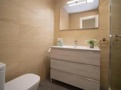 a bathroom with a sink and a mirror at SibsSanlucar Calma - Centro y Playa - Nuevo in Sanlúcar de Barrameda