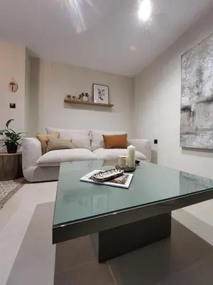 a living room with a table and a couch at Luxe Apartamento Duque de Alta in Arcos de la Frontera