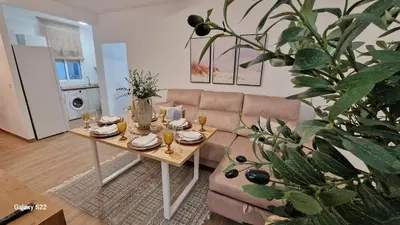 a living room with a table and a couch at MANZANILLA CENTRO PLAYA in Sanlúcar de Barrameda