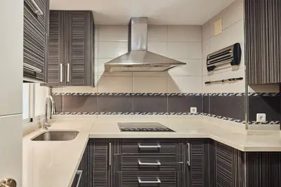 a kitchen with a sink and a stove at Gades Zuloaga Ha in Cádiz