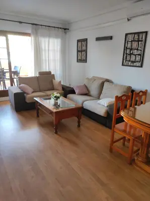 a living room with a couch and a coffee table at EA bahía sur in San Fernando