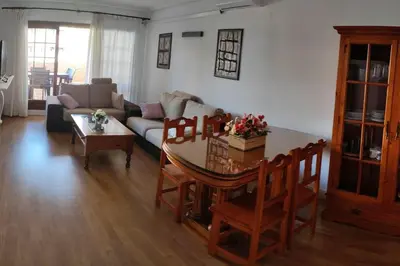 a living room with a table and a couch at EA bahía sur in San Fernando