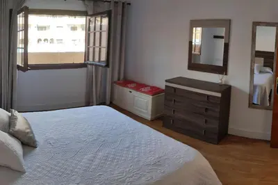 a bedroom with a bed and a dresser and a mirror at EA bahía sur in San Fernando
