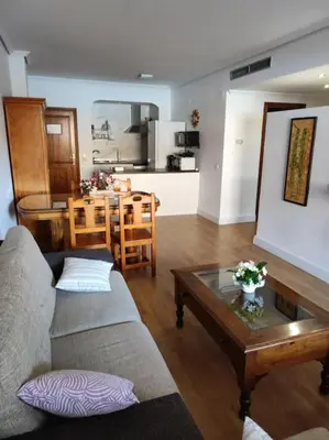 a living room with a couch and a table at EA bahía sur in San Fernando