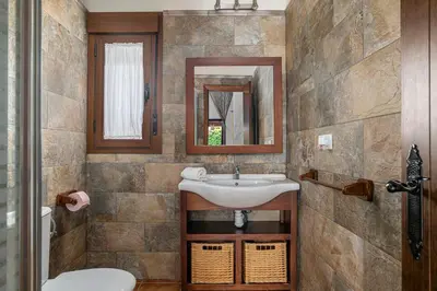a bathroom with a sink and a mirror at Villa Marta Clara in Conil de la Frontera