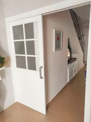 a door leading into a hallway with a living room at Apartamento en Chiclana de la Frontera in Chiclana de la Frontera