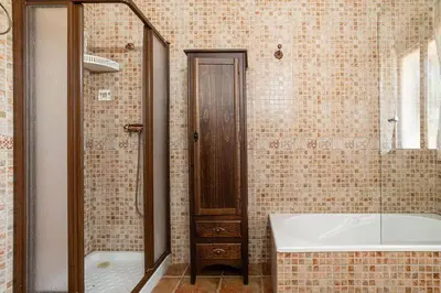 a bathroom with a tub and a sink and a bath tub at Casa Cala Puntalejo in Conil de la Frontera