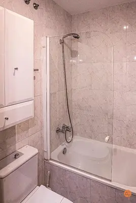 a bathroom with a shower and a toilet and a tub at El Pelícano Parking free Grupo Ac Gestion in Cádiz
