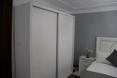 a bedroom with a large white closet and a bed at Villa completa con piscina en Arcos de la frontera in Arcos de la Frontera
