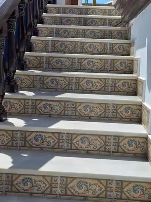 a set of stairs with intricate tiles on them at Villa completa con piscina en Arcos de la frontera in Arcos de la Frontera