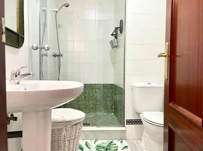 a bathroom with a sink and a toilet and a shower at La Serena, Unifamiliar adosada en La Barrosa in Chiclana de la Frontera