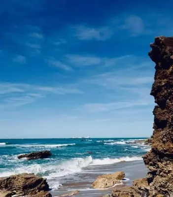 a view of the ocean from a rocky beach at La Serena, Unifamiliar adosada en La Barrosa in Chiclana de la Frontera