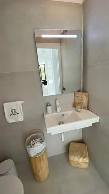 a bathroom with a sink and a mirror at Mas del Cullou, moderne Villa in Andalusien, in der Nähe vom Meer in Cádiz