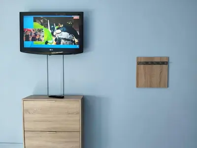 a flat screen tv on top of a dresser at Casa Ana in Jerez de la Frontera