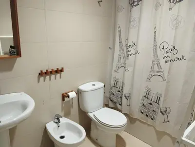 a bathroom with a toilet and a sink at Casa Ana in Jerez de la Frontera