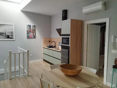 a kitchen and dining room with a table in a room at casa la zarzamora in Jerez de la Frontera
