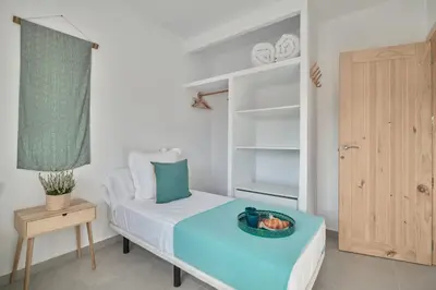 a bedroom with a bed with a bowl of fruit on it at Tío Pa - Tucasaenconil in Roche