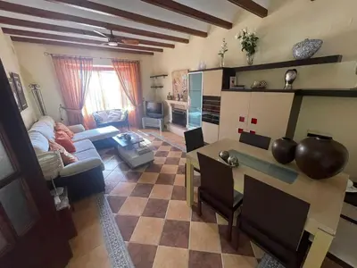 a living room with a person laying on a couch at Villa Bolet in Chiclana de la Frontera