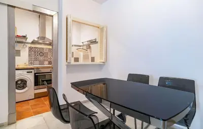 a dining room table and chairs in a kitchen at Pet Friendly Apartment in El Puerto de Santa María