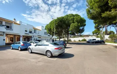 a group of cars parked in a parking lot at Pet Friendly Apartment in El Puerto de Santa María