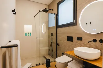 a bathroom with a sink and a shower at Casa Cuatro Boutique Hotel - Adults Recommended in Novo Sancti Petri