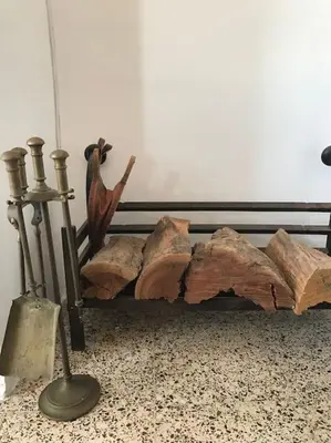 a statue of a bird sitting next to a log at Apartamento primera linea de playa in Rota