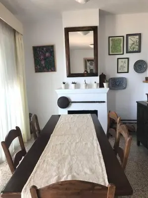 a dining room with a table and a sink at Apartamento primera linea de playa in Rota