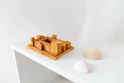 a model of a castle on a table with a shell at Norte y Sur by Gades Gestión in San Fernando