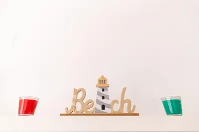 a wooden shelf with a lighthouse and three cups at Norte y Sur by Gades Gestión in San Fernando
