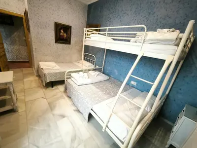 a room with two bunk beds in a room at Cielos Casona in El Puerto de Santa María