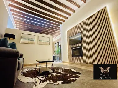 a living room with a couch and a table at Winahost Algar Rural in Algar