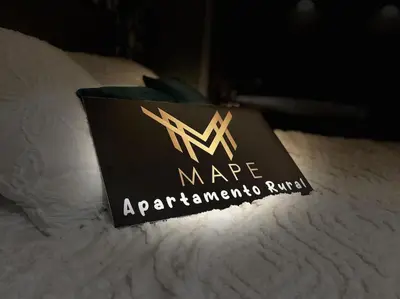 a sign sitting on top of a bed at Winahost Algar Rural in Algar