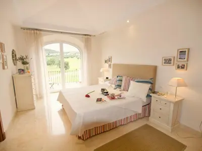 a bedroom with a white bed with a window at Villa 210 by Villamya in Arcos de la Frontera