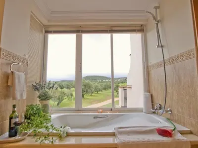 a bath tub in a bathroom with a window at Villa 210 by Villamya in Arcos de la Frontera