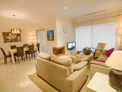 a living room with a couch and a dining room at Villa 210 by Villamya in Arcos de la Frontera