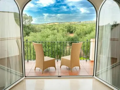 two chairs sitting on a balcony with a view at Villa 210 by Villamya in Arcos de la Frontera