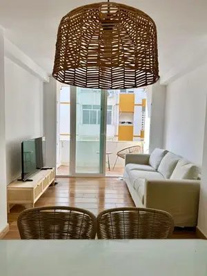 a living room with a couch and two chairs at Casita de la playa en Durango in El Puerto de Santa María