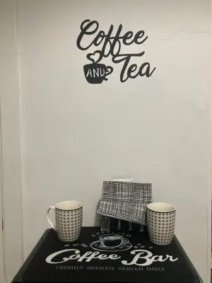 a table with two coffee and tea cups on it at Apartamento Empedrado in Jerez de la Frontera