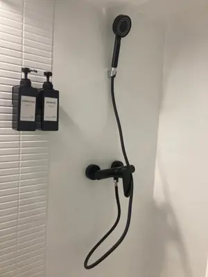 a bathroom with a blow dryer on the wall at Apartamento Empedrado in Jerez de la Frontera