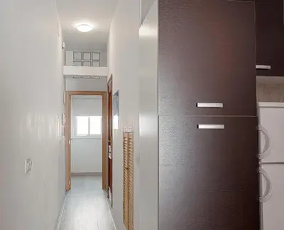 a hallway with a sliding door in a house at CDZ - Carmen Coronada in Cádiz