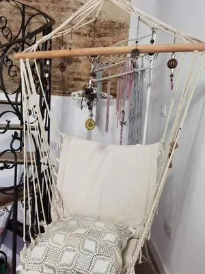 a hanging porch swing with a pillow at La casa vertical in Cádiz