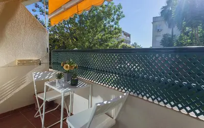 a small table and chairs on a balcony at Amplio y Luminoso 3 Rooms Parking in Jerez de la Frontera