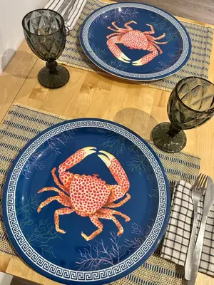two blue plates with crabs on them on a table at Estudio Casa Palacio 2Pax wifi gratis in Sanlúcar de Barrameda