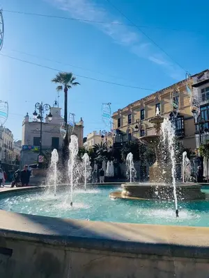 a fountain in the middle of a city at Estudio Casa Palacio 2Pax wifi gratis in Sanlúcar de Barrameda
