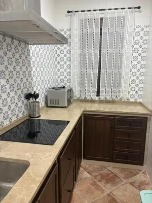 a kitchen with a sink and a toaster at Villa jiguera in Cádiz