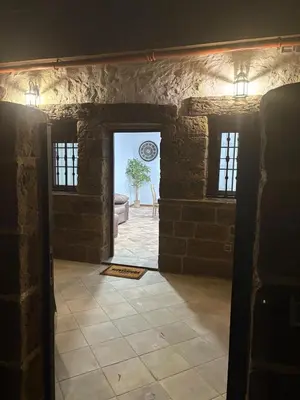 an entrance to a room with a stone wall at Villa jiguera in Cádiz