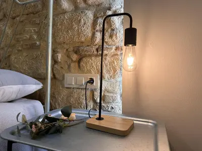 a glass table with a lamp on top of a bed at Apartamento Santa Clara - Ole Solutions in Jerez de la Frontera