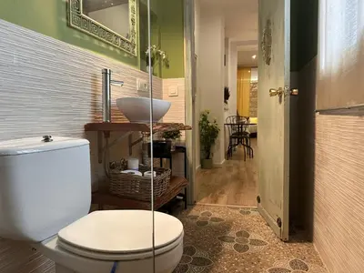a bathroom with a toilet and a sink at Apartamento Santa Clara - Ole Solutions in Jerez de la Frontera