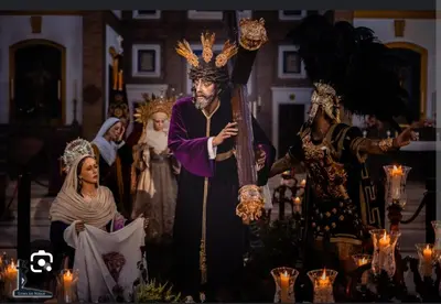a group of people dressed up in costumes with candles at Patio & Sherry Apartamento in Jerez de la Frontera