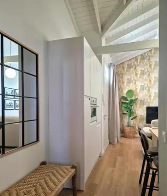 a living room with a couch and a dining room at AGR Apartamento Villapanés in Jerez de la Frontera